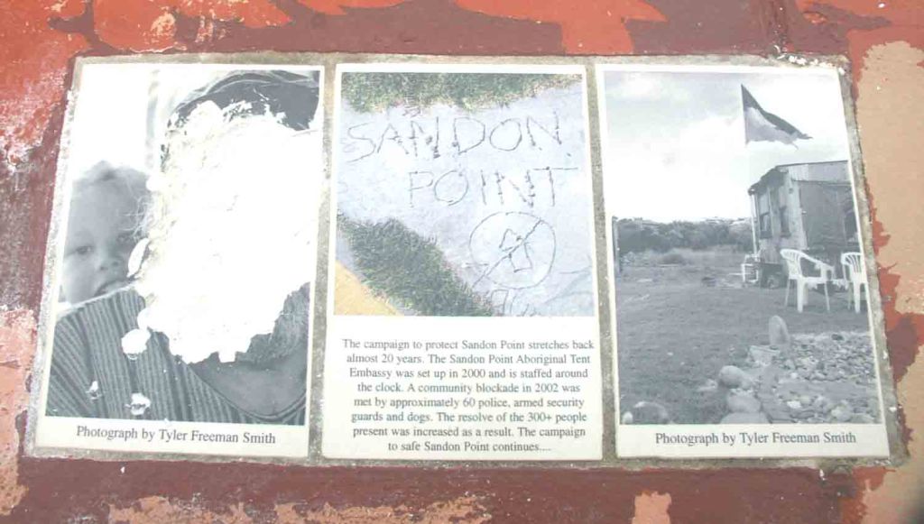 One of the vandalised plaques. The vandals seem to indicate that the plaque should be located at Sandon Point, Bulli, rather than at Collins Point, Woonona.