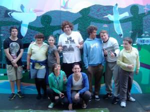Youth celebrate the completion of the Thirroul mural project.