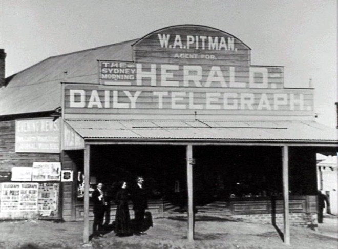Pitman’s Newsagency, Woonona C1918. The shop was built by Henry Pitman who is shown at the left with his wife Rachel and son William Austin.